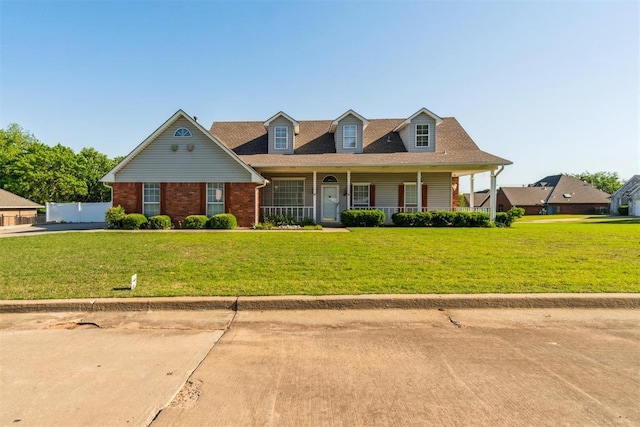 view of front of home featuring a porch and brick siding