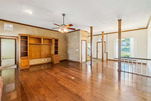unfurnished living room featuring dark wood-style floors, ornamental molding, ceiling fan, and baseboards