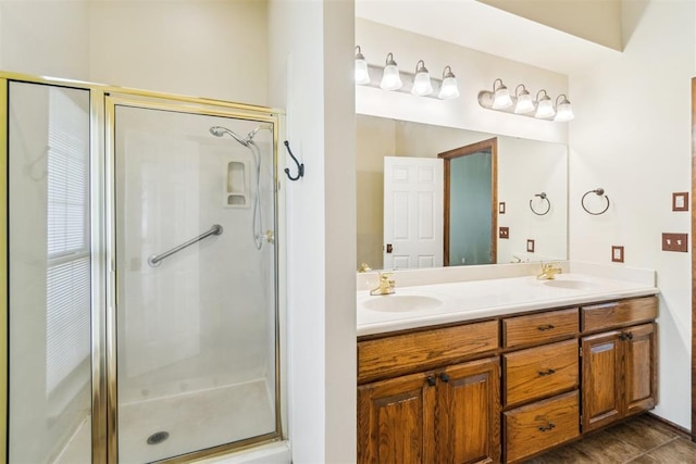 full bathroom with a stall shower and double vanity