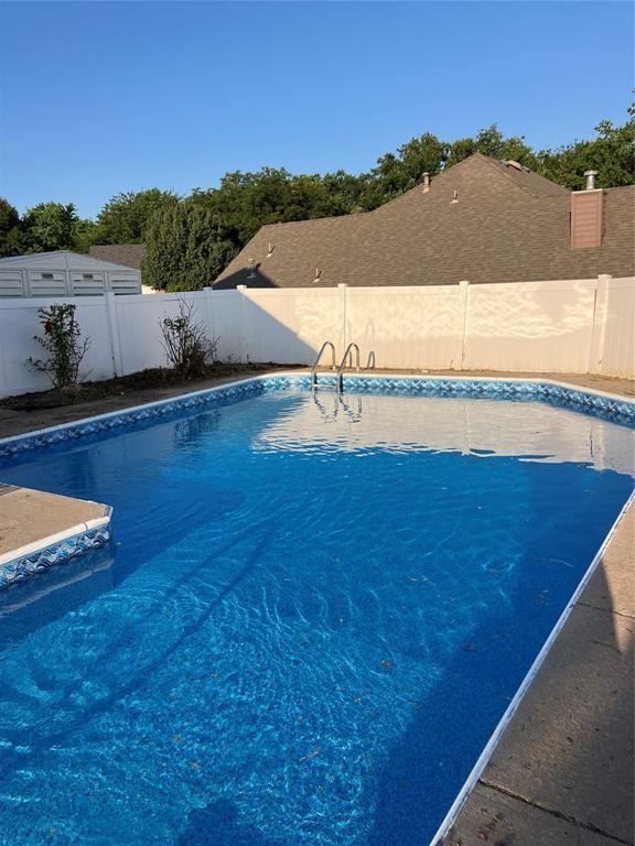 view of pool featuring a fenced backyard
