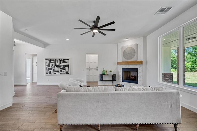 941 Siena Springs Dr, Norman, OK 73071 - living area featuring baseboards, a ceiling fan, wood finished floors, a fireplace, and recessed lighting