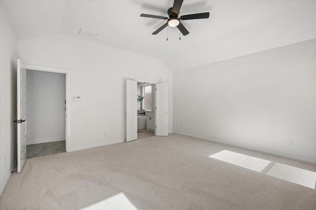 941 Siena Springs Dr, Norman, OK 73071 - unfurnished bedroom with lofted ceiling, light carpet, baseboards, ensuite bathroom, and ceiling fan