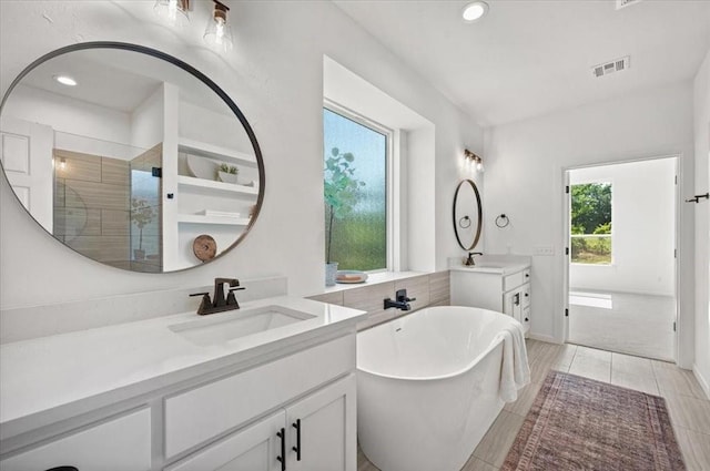 941 Siena Springs Dr, Norman, OK 73071 - full bath featuring recessed lighting, a freestanding bath, a shower stall, and two vanities