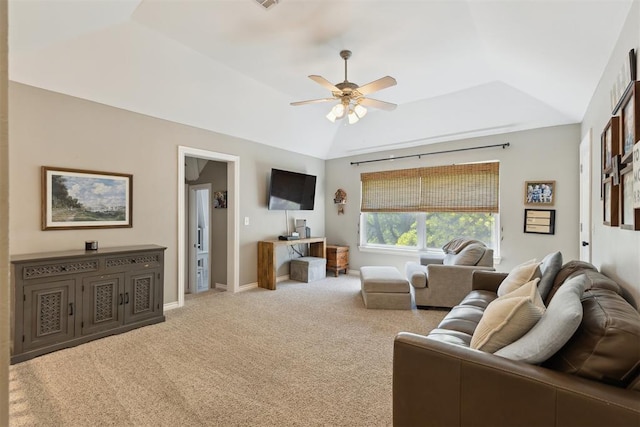 carpeted living area with ceiling fan, lofted ceiling, and baseboards