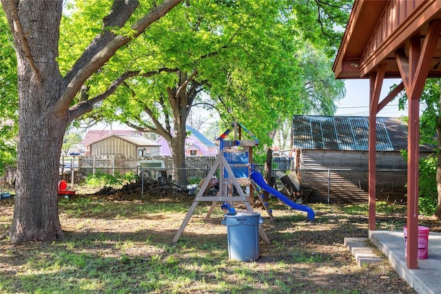 view of jungle gym with fence