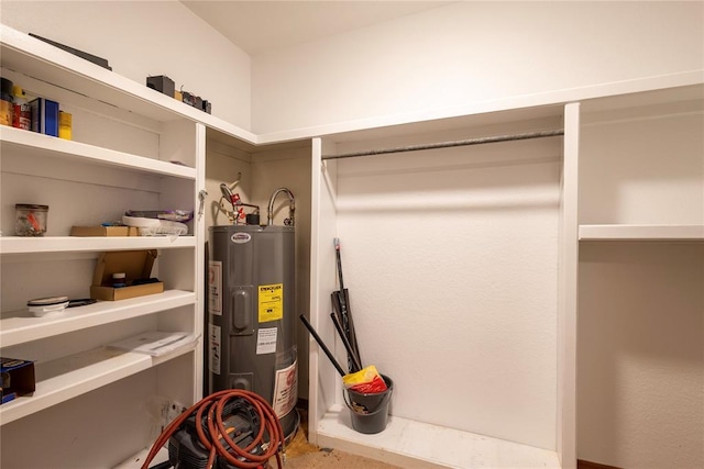 utility room with electric water heater