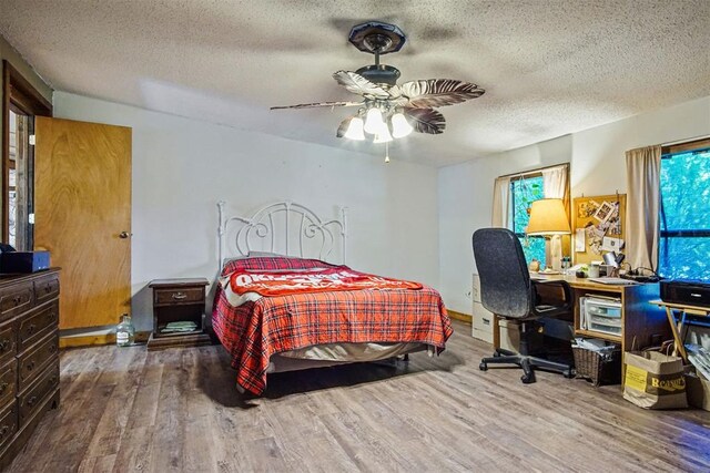 114166 S 4209th Rd, Eufaula, OK 74432 - bedroom with wood finished floors, a textured ceiling, and ceiling fan