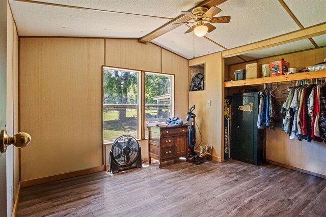 114166 S 4209th Rd, Eufaula, OK 74432 - bedroom featuring wood finished floors, wooden walls, a textured ceiling, and baseboards