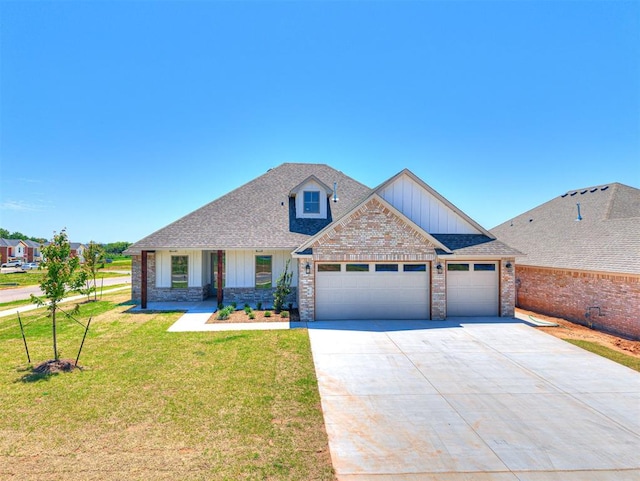 2716 Dunham Dr, Norman, OK 73071 - craftsman house featuring an attached garage, a front lawn, concrete driveway, board and batten siding, and brick siding