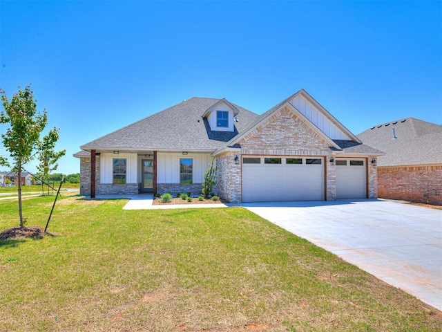 2716 Dunham Dr, Norman, OK 73071 - craftsman-style house featuring board and batten siding, a garage, driveway, a front yard, and a shingled roof