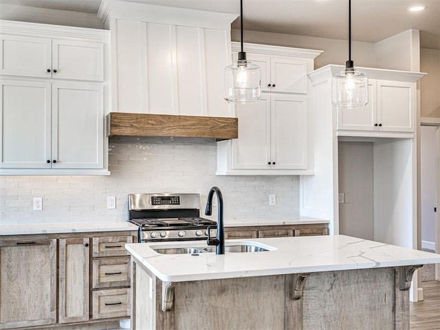 2716 Dunham Dr, Norman, OK 73071 - kitchen with light stone counters, stainless steel gas range, a sink, tasteful backsplash, and recessed lighting