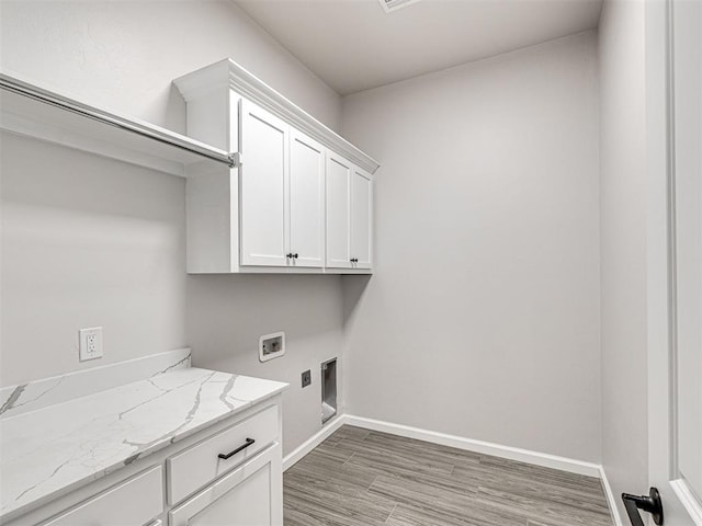 2716 Dunham Dr, Norman, OK 73071 - laundry room with cabinet space, hookup for a washing machine, light wood finished floors, baseboards, and electric dryer hookup