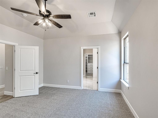 2716 Dunham Dr, Norman, OK 73071 - unfurnished bedroom with light carpet, lofted ceiling, baseboards, and ceiling fan