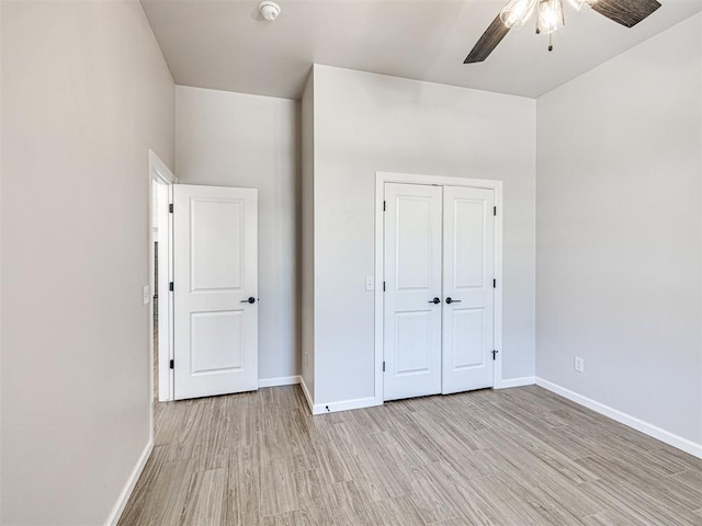 2716 Dunham Dr, Norman, OK 73071 - unfurnished bedroom with light wood-style flooring, baseboards, and a closet
