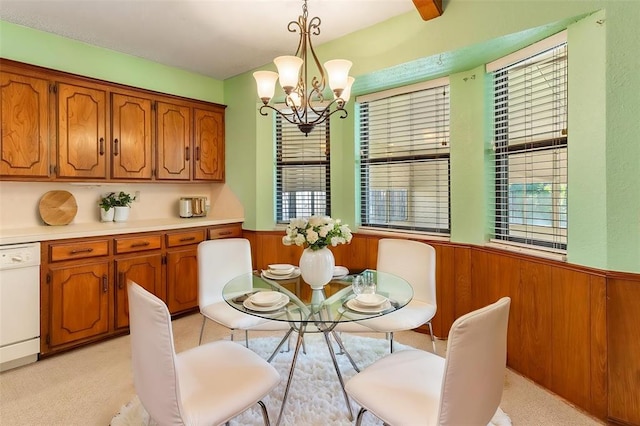 2613 SW 95th St, Oklahoma City, OK 73159 - dining room with a wainscoted wall, a chandelier, and wood walls