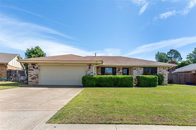 2613 SW 95th St, Oklahoma City, OK 73159 - ranch-style house featuring brick siding, an attached garage, and driveway