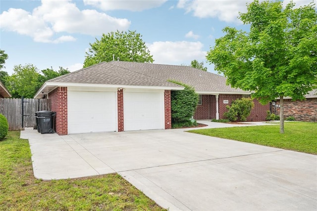 single story home featuring roof with shingles and brick siding