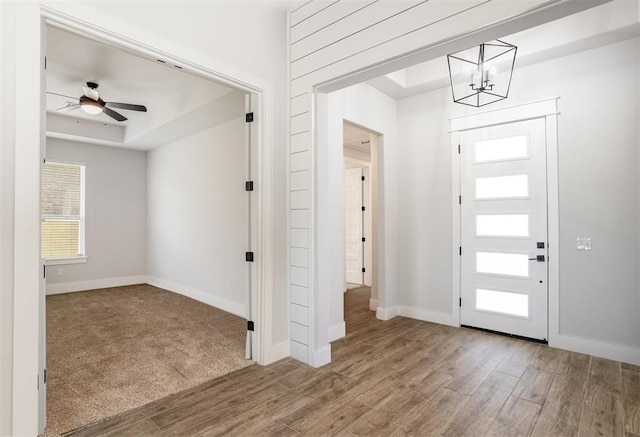 2246 Jackson Ln, Blanchard, OK 73010 - foyer entrance featuring wood finished floors, a chandelier, baseboards, and a ceiling fan