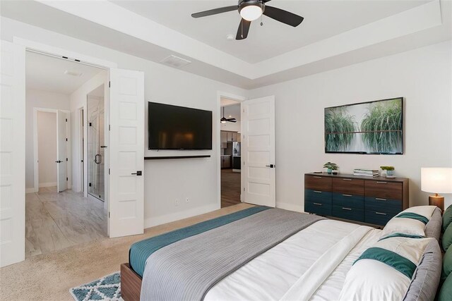 2246 Jackson Ln, Blanchard, OK 73010 - bedroom featuring light carpet, baseboards, and a ceiling fan