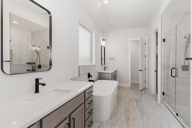 2246 Jackson Ln, Blanchard, OK 73010 - full bath featuring a shower stall, a soaking tub, marble finish floors, two vanities, and baseboards
