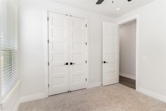 2246 Jackson Ln, Blanchard, OK 73010 - unfurnished bedroom featuring a closet, carpet flooring, baseboards, and ceiling fan