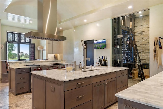 4400 NW 150th St, Oklahoma City, OK 73134 - kitchen featuring island exhaust hood, a center island with sink, light stone counters, recessed lighting, and a sink