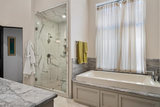 4400 NW 150th St, Oklahoma City, OK 73134 - full bath featuring a bath, a marble finish shower, and marble look tile flooring
