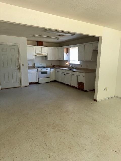 116 N Mahan St, El Reno, OK 73036 - kitchen with white range with gas stovetop, white cabinetry, and under cabinet range hood