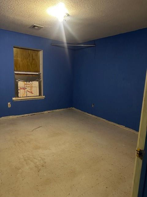 116 N Mahan St, El Reno, OK 73036 - empty room with a textured ceiling