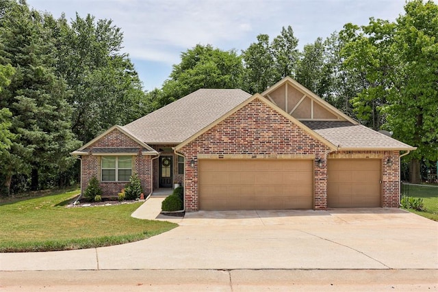 12360 Hidden Run Rd, Guthrie, OK 73044 - view of front of house featuring a garage, concrete driveway, a front lawn, brick siding, and roof with shingles
