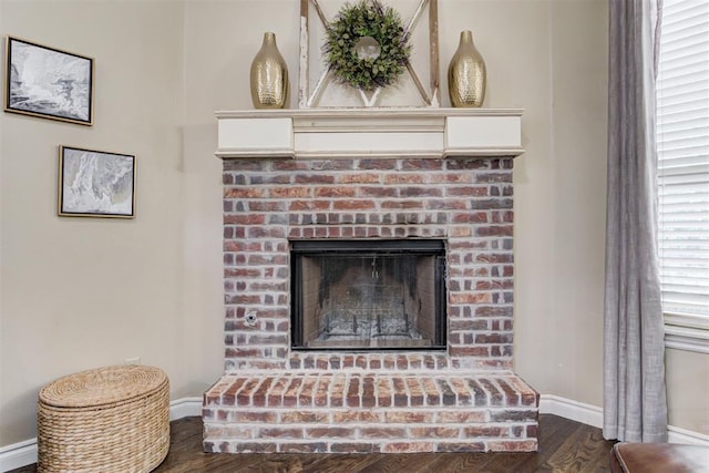 12360 Hidden Run Rd, Guthrie, OK 73044 - detailed view of baseboards, wood finished floors, and a brick fireplace