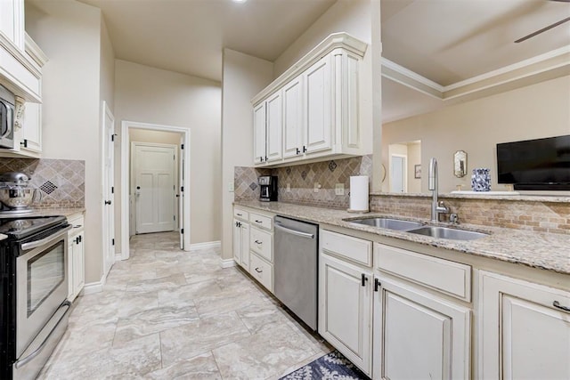 12360 Hidden Run Rd, Guthrie, OK 73044 - kitchen featuring appliances with stainless steel finishes, a sink, tasteful backsplash, light stone counters, and baseboards