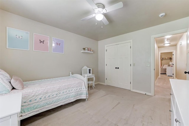12360 Hidden Run Rd, Guthrie, OK 73044 - bedroom featuring light colored carpet, baseboards, a closet, and a ceiling fan