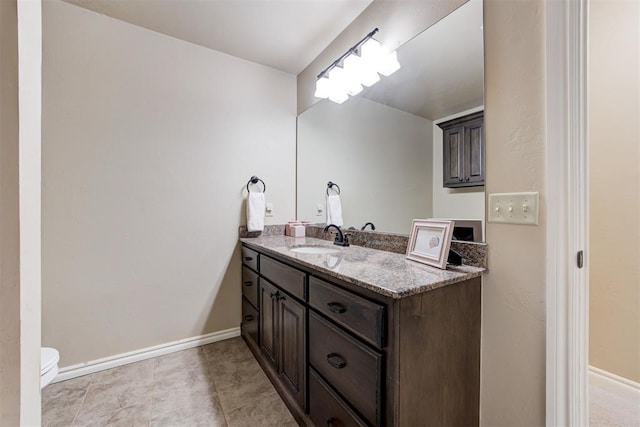 12360 Hidden Run Rd, Guthrie, OK 73044 - bathroom featuring vanity, toilet, and baseboards