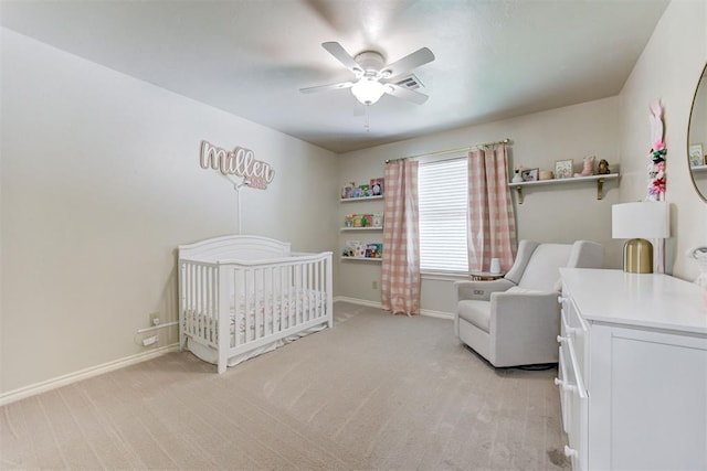 12360 Hidden Run Rd, Guthrie, OK 73044 - bedroom with a nursery area, light colored carpet, baseboards, and ceiling fan