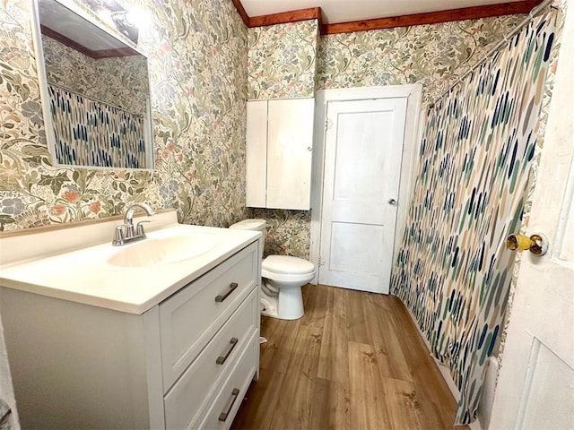 full bathroom with wallpapered walls, wood finished floors, vanity, toilet, and a shower with shower curtain