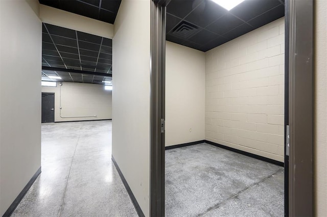 124 N Main St, Broken Bow, OK 74728 - corridor featuring concrete floors, baseboards, and concrete block wall