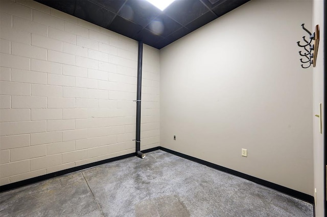 124 N Main St, Broken Bow, OK 74728 - empty room featuring concrete floors and baseboards