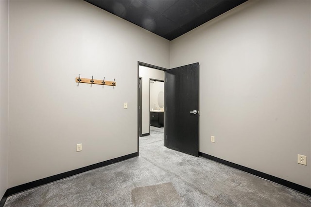 124 N Main St, Broken Bow, OK 74728 - unfurnished room featuring baseboards and light carpet