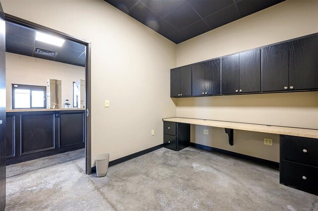 124 N Main St, Broken Bow, OK 74728 - unfurnished office featuring concrete flooring and baseboards