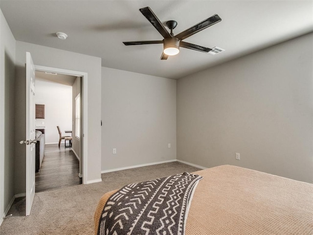 200 Dooley Creek Ln, Edmond, OK 73003 - carpeted bedroom with baseboards and ceiling fan