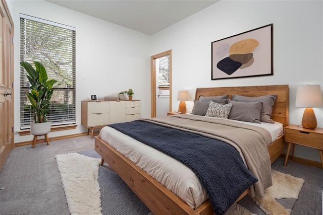 carpeted bedroom with baseboards