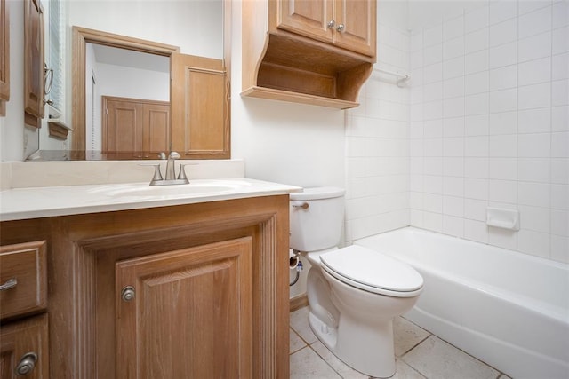 full bathroom featuring toilet, vanity, tile patterned flooring, and bathing tub / shower combination