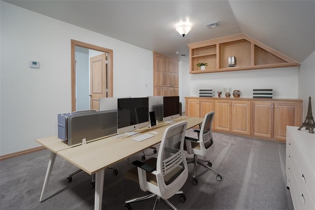 office area with light carpet and vaulted ceiling
