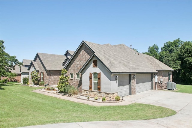 5625 Courtland Ln, Choctaw, OK 73020 - view of front of home featuring cooling unit, brick siding, a front lawn, and concrete driveway