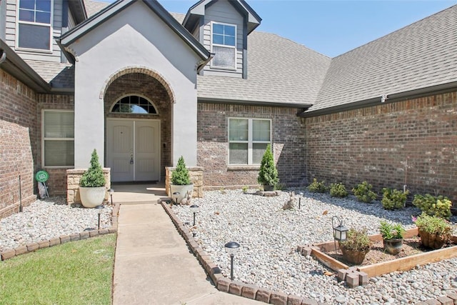 5625 Courtland Ln, Choctaw, OK 73020 - property entrance with brick siding and roof with shingles