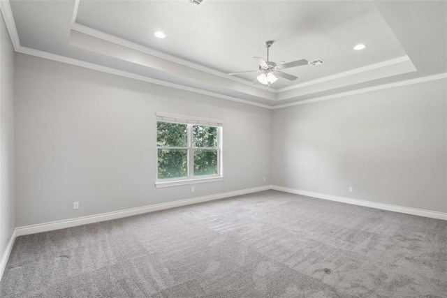 5625 Courtland Ln, Choctaw, OK 73020 - unfurnished room featuring a tray ceiling, a ceiling fan, ornamental molding, carpet flooring, and baseboards