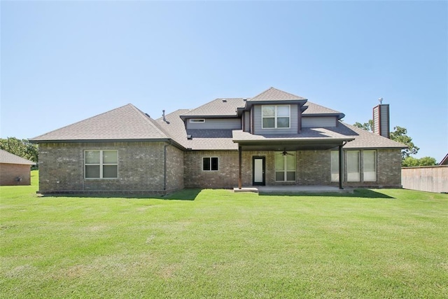 5625 Courtland Ln, Choctaw, OK 73020 - rear view of property with a lawn, a patio area, and a chimney