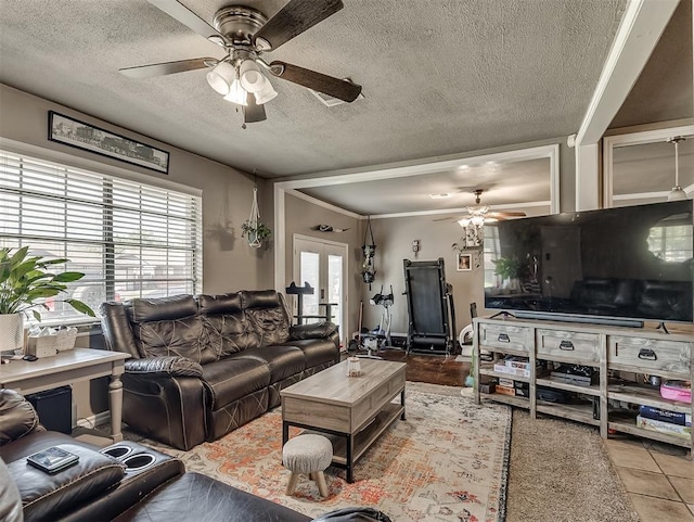 717 SW 4th Pl, Moore, OK 73160 - tiled living room with ceiling fan and a textured ceiling