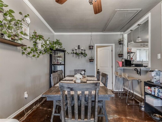 717 SW 4th Pl, Moore, OK 73160 - dining area featuring attic access, finished concrete floors, baseboards, crown molding, and a ceiling fan